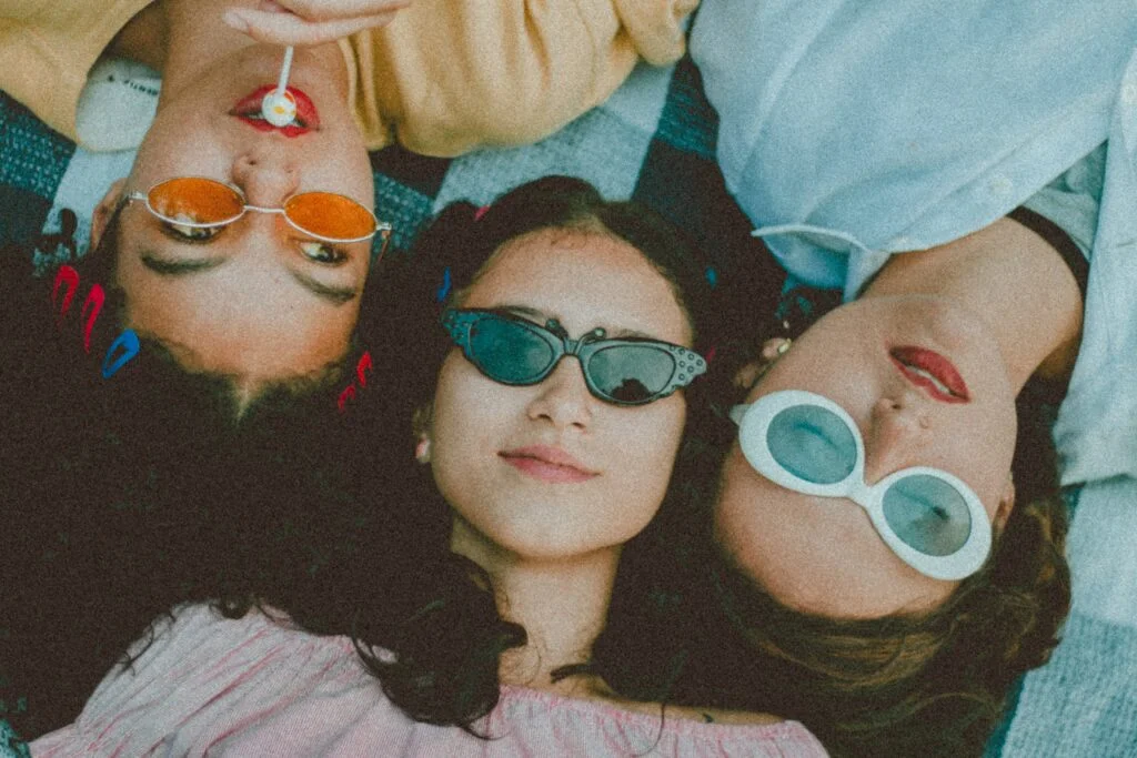 photo of three women wearing cool sunglasses
