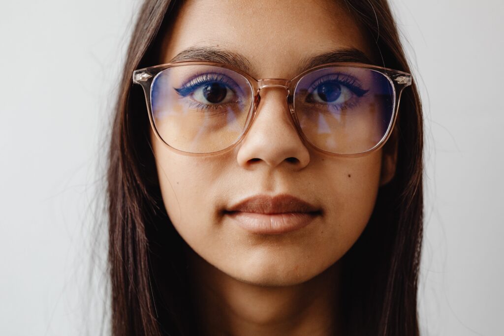 photo of woman wearing blue-light glasses