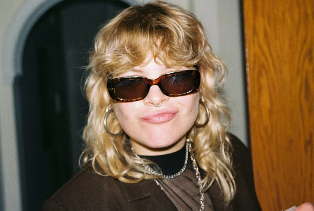 photo of woman wearing aesthetic sunglasses