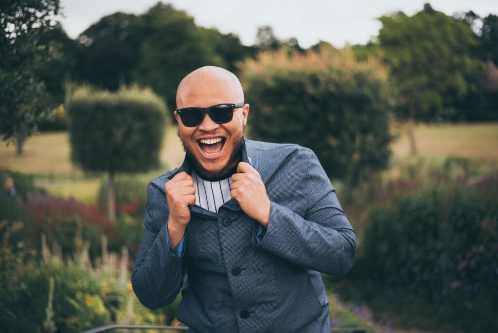 photo of happy man wearing sunglasses