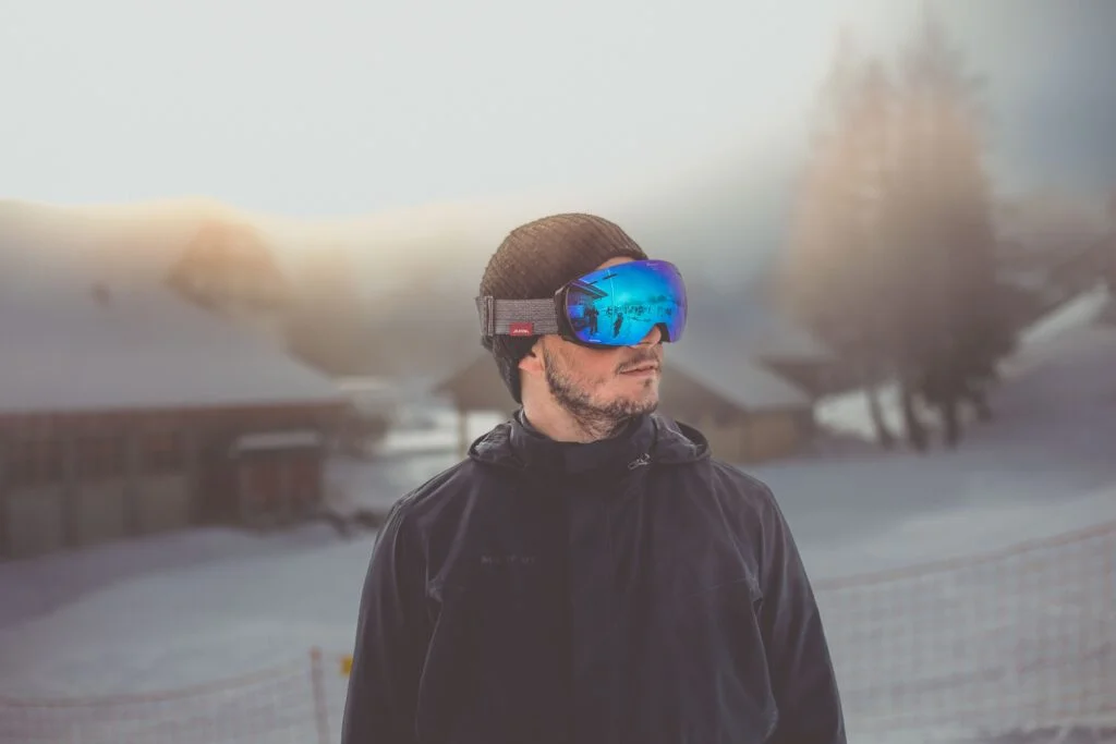 photo of man wearing sports skiing glasses
