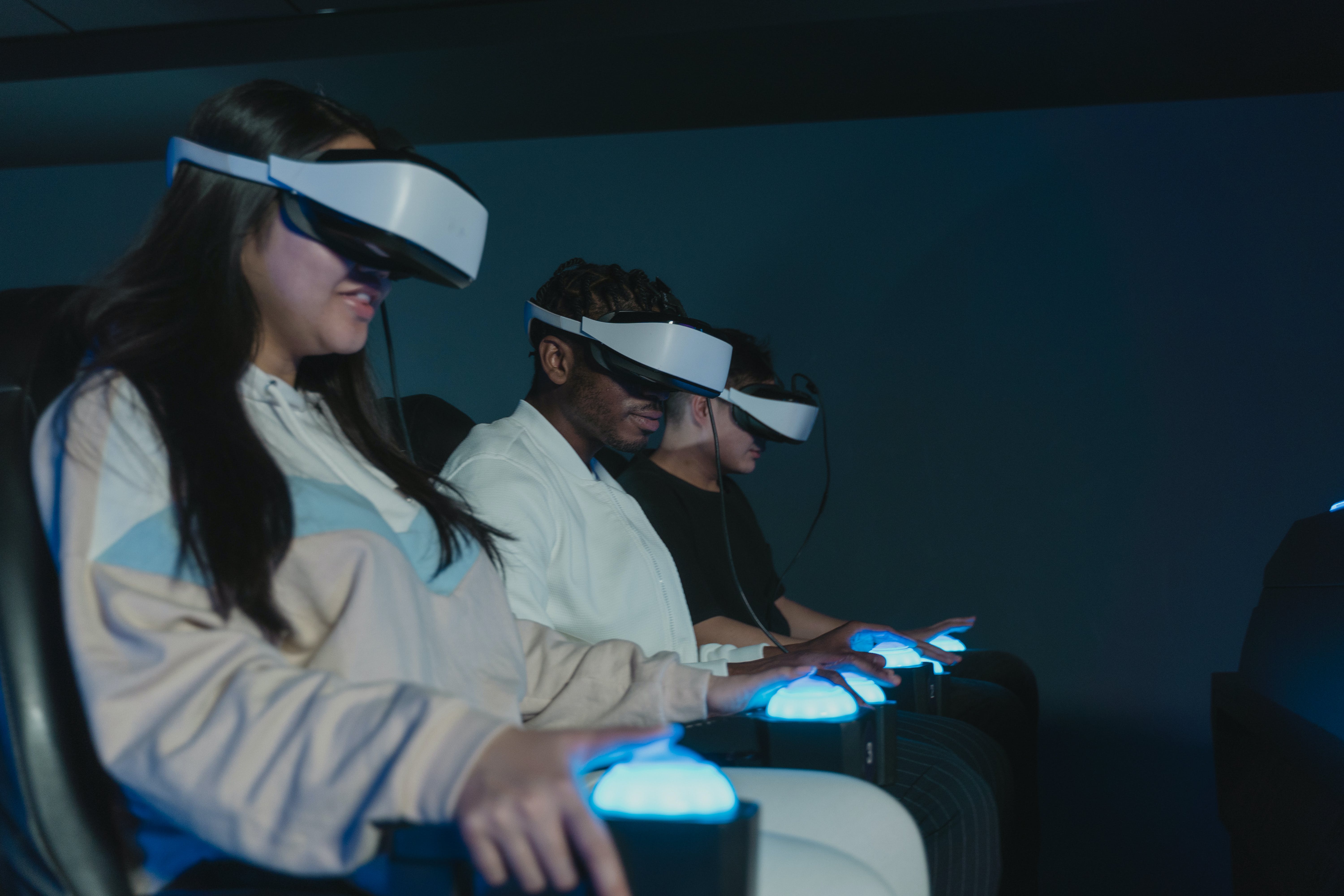 photo of three people using AR headsets